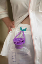 Just Because Love Does Healing Collection pajama bottoms in white and pink, showcasing a reinforced waistband channel for secure medical bag use.