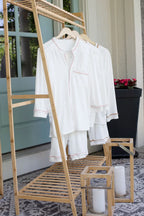 Just Because Love Does Healing Collection medical pajama sets on hangers